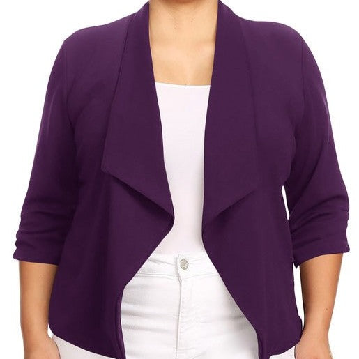 Our Plus Size Solid Waist Length Blazer featuring a relaxed fit and open front, designed in a waist-length style, complete with a draped neckline and rolled-up sleeves with ruched detailing.