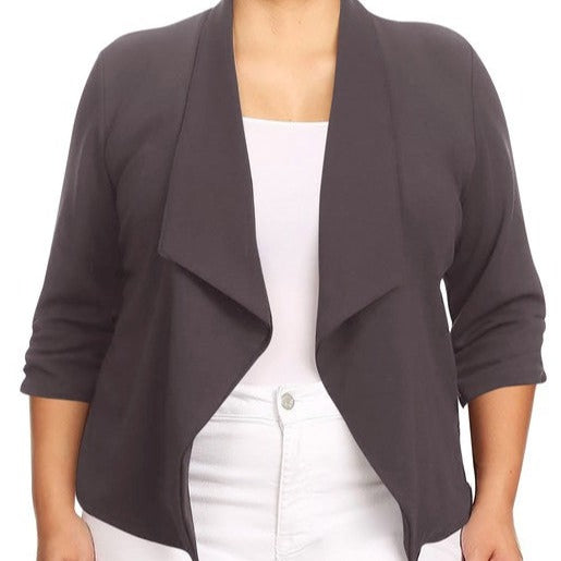 Our Plus Size Solid Waist Length Blazer featuring a relaxed fit and open front, designed in a waist-length style, complete with a draped neckline and rolled-up sleeves with ruched detailing.