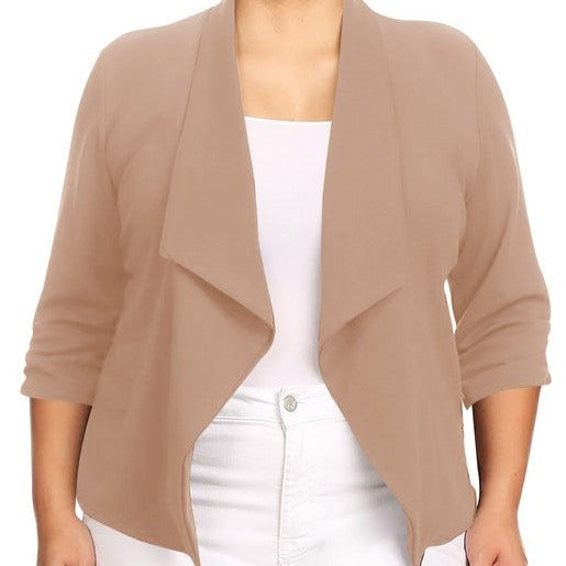 Our Plus Size Solid Waist Length Blazer featuring a relaxed fit and open front, designed in a waist-length style, complete with a draped neckline and rolled-up sleeves with ruched detailing.