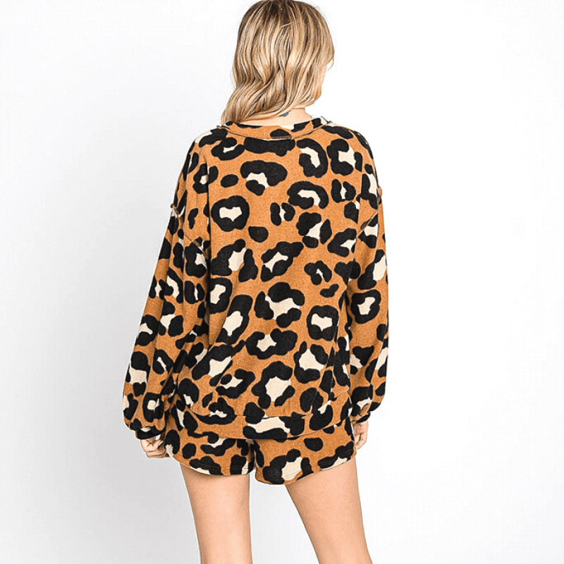 This animal print lounge sweater and short set lands below the hip and shows off a visible overlock stitch detailing. The high stretch fabric is non sheer and its comfortable to wear.
