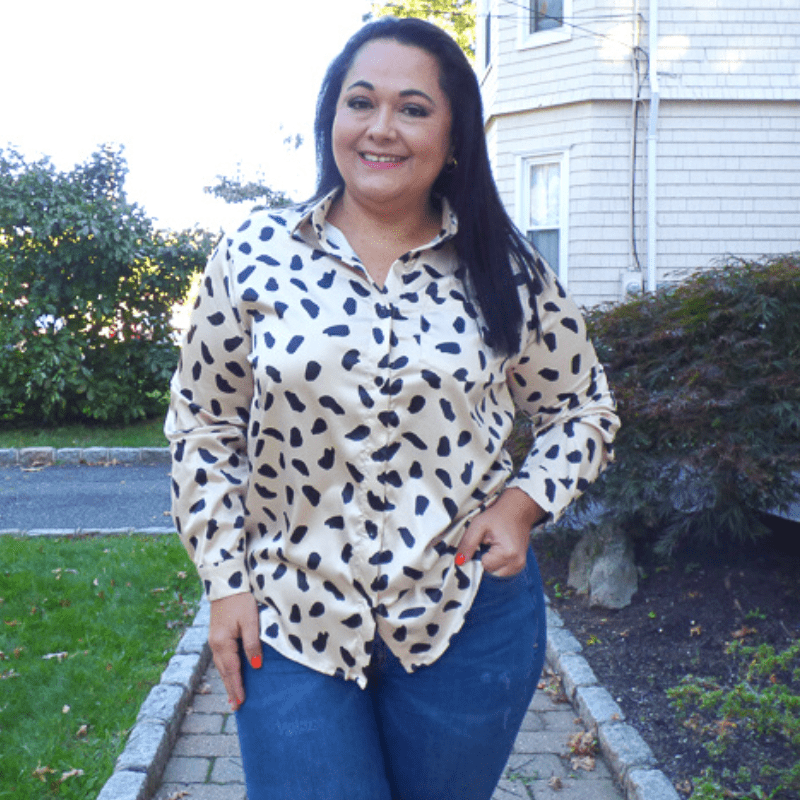 This Silky Animal Print Plus Size Button Down Top featuring a lightweight material, button down front with a collared neckline and long loose sleeves.