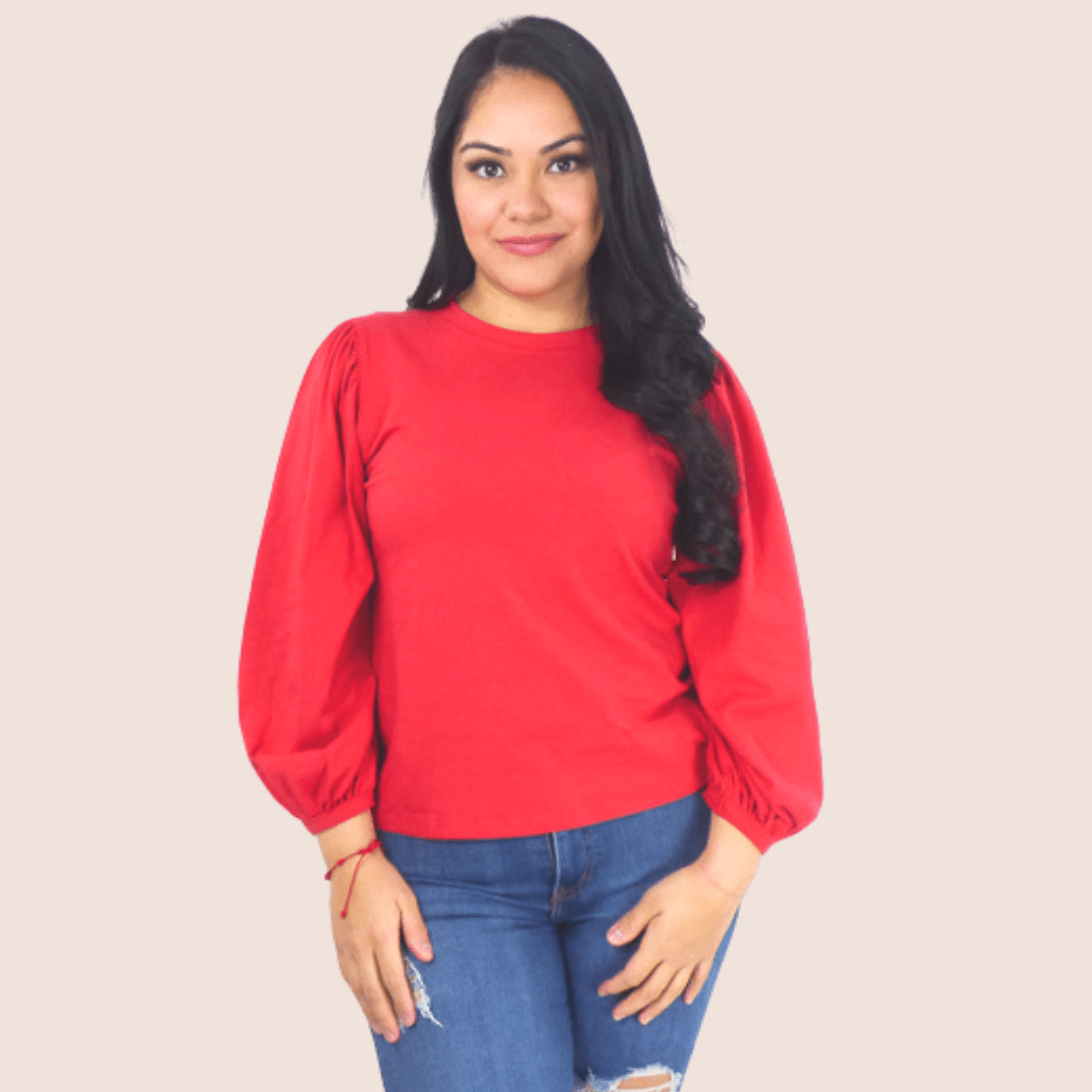 Our Balloon Long Sleeve Top will add a Victorian elegance to your wardrobe. The pull-over style features oversized balloon long sleeves and a round neckline.
