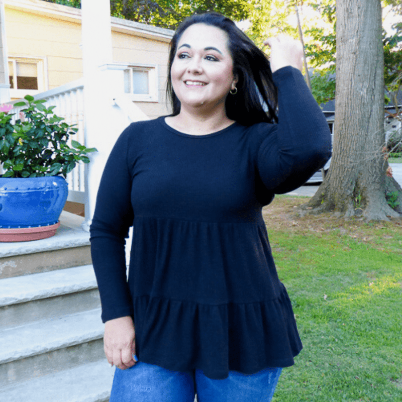 Get ready to wow with this casual babydoll top featuring soft, lightweight, ribbed flowy material, a scoop neckline, long sleeves, and a relaxed tiered babydoll silhouette.