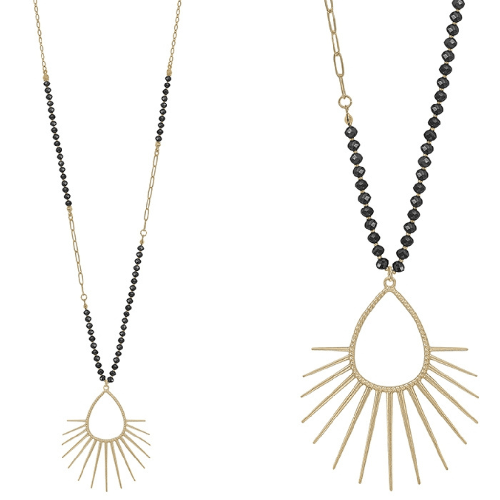 Complete your look with this multi-color crystal and gold color spiked teardrop necklace. The perfect length for layering or wearing alone with your favorite dress.