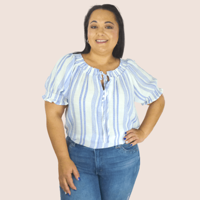 This relaxed fit top has a straight hem that sits below the hip. With it's slightly sheer fabric, is perfect to style with shorts and your favorite sandals.