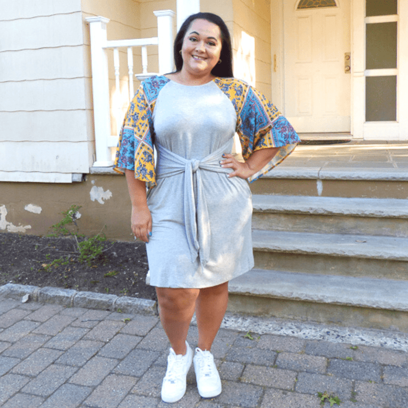 A boho style dress perfect for a casual event. This Plus Size Dress features a paisley print, pockets and a straight hemline.
