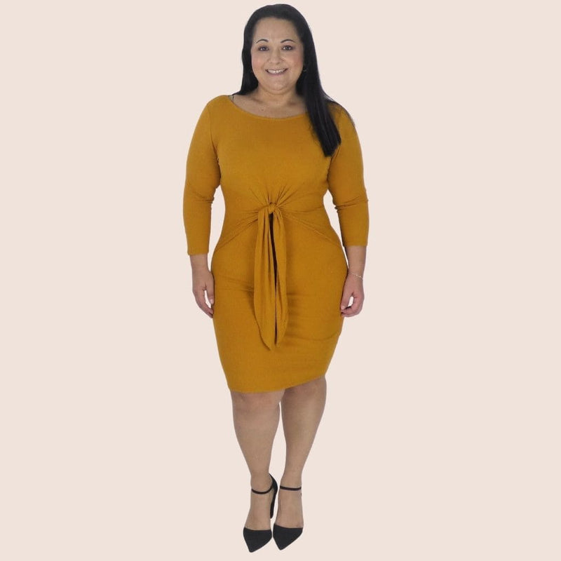 Peekaboo Bow Tie Plus Dress gives the impression of a two piece set while providing the comfort of a one piece dress. Great for the office or a night out