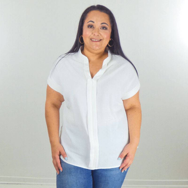 Soft, sheer, and feminine, this band collar plus size top features a V-neckline and a round hem. A staple in any wardrobe.