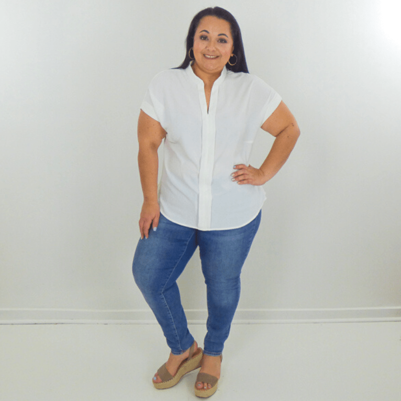 Soft, sheer, and feminine, this band collar plus size top features a V-neckline and a round hem. A staple in any wardrobe.