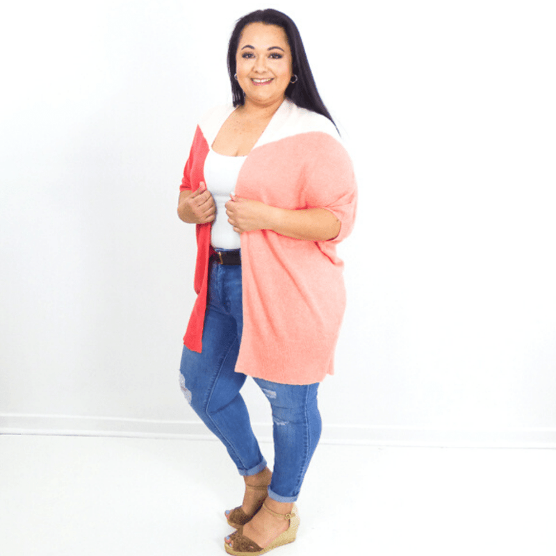 Stand out from the crowd in this statement pop color block cardigan. Lightweight, versatile and comfortable enough to go anywhere.
