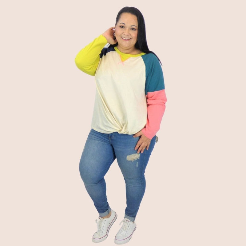 This Long Sleeve Cotton Plus Top features a raglan neck, color blocked sleeves. Add some charm to your laidback style with this simple, everyday top.