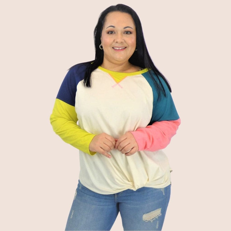 This Long Sleeve Cotton Plus Top features a raglan neck, color blocked sleeves. Add some charm to your laidback style with this simple, everyday top.