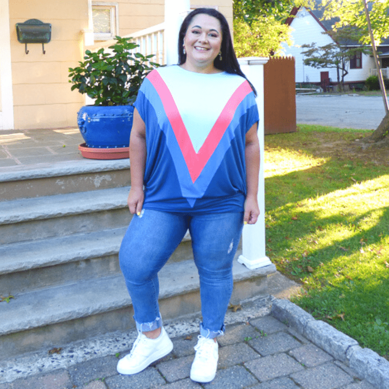 The Color Block Dolman Short Sleeve Top features a bold color combination that makes it the perfect everyday top. This top is designed to sit below the hip.
