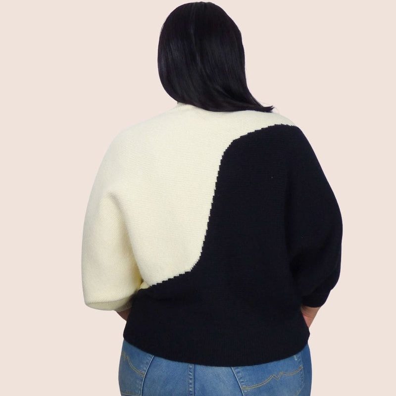 The soft and stretchy fabric of this plus size dolman two tone sweater makes it comfy, while the relaxed fit pairs great with jeans or a skinny trouser.
