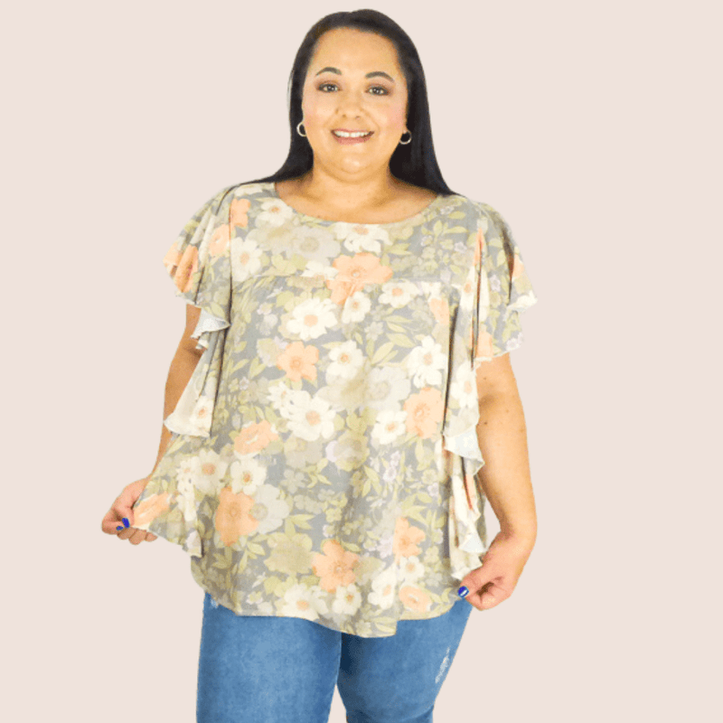 Break out of your summer fashion rut with this gorgeous muted floral print plus size, side ruffle top. The high round collar and shirt sleeve make this a must-have.
