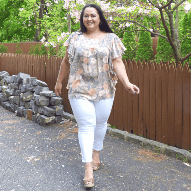 Break out of your summer fashion rut with this gorgeous muted floral print plus size, side ruffle top. The high round collar and shirt sleeve make this a must-have.
