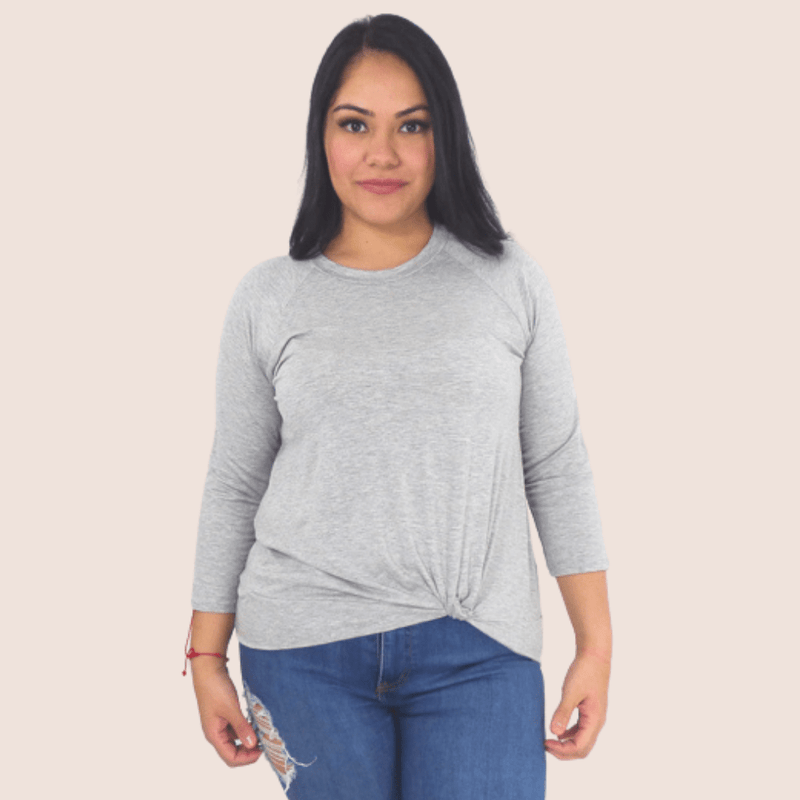 Our Front Knot Log Sleeve Top is the perfect transition piece. This shirt features a loose-fitting front knot and 3/4 sleeves for a comfortable, flattering look.