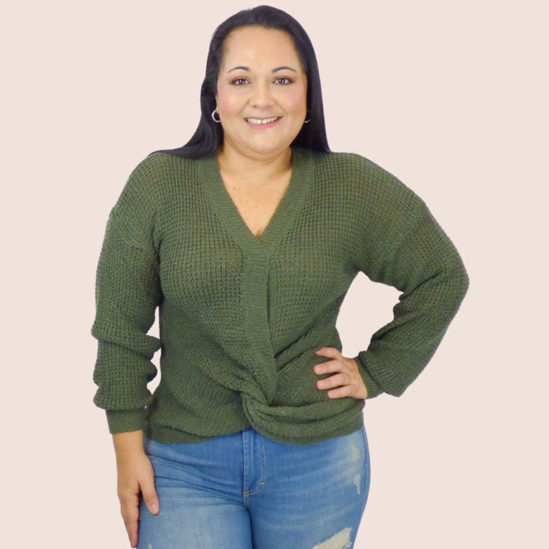 This plus size pullover front knot sweater features a loose-fitting front knot and ribbed details on the sleeves and bottom hem for a tasteful, flattering look