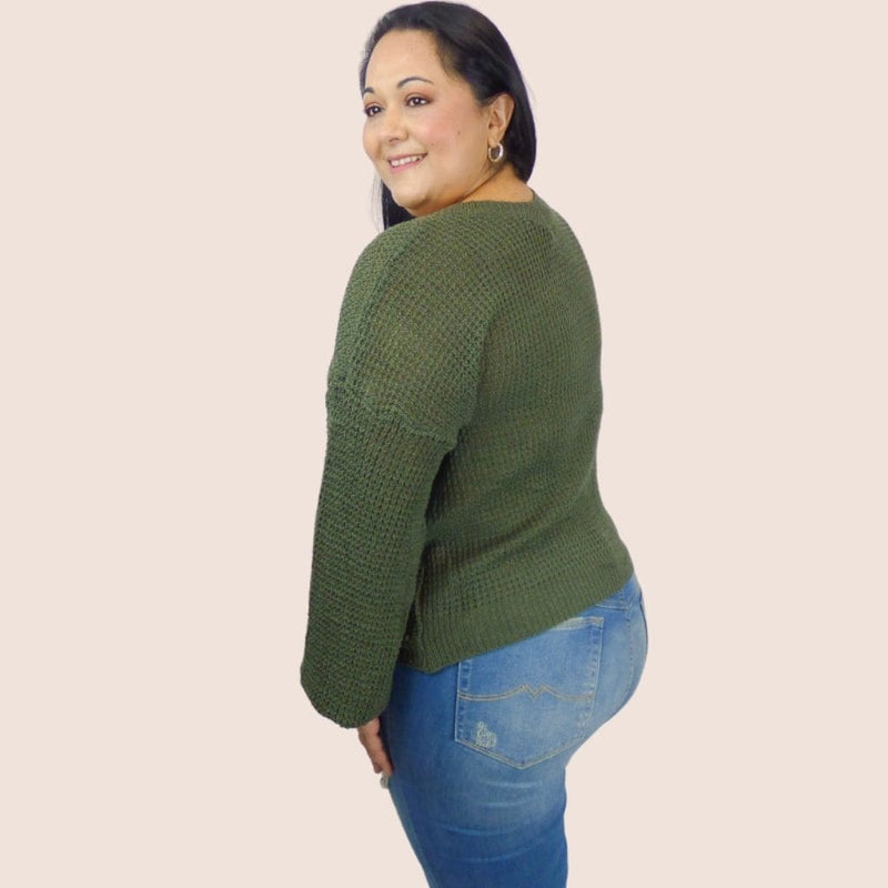 This plus size pullover front knot sweater features a loose-fitting front knot and ribbed details on the sleeves and bottom hem for a tasteful, flattering look