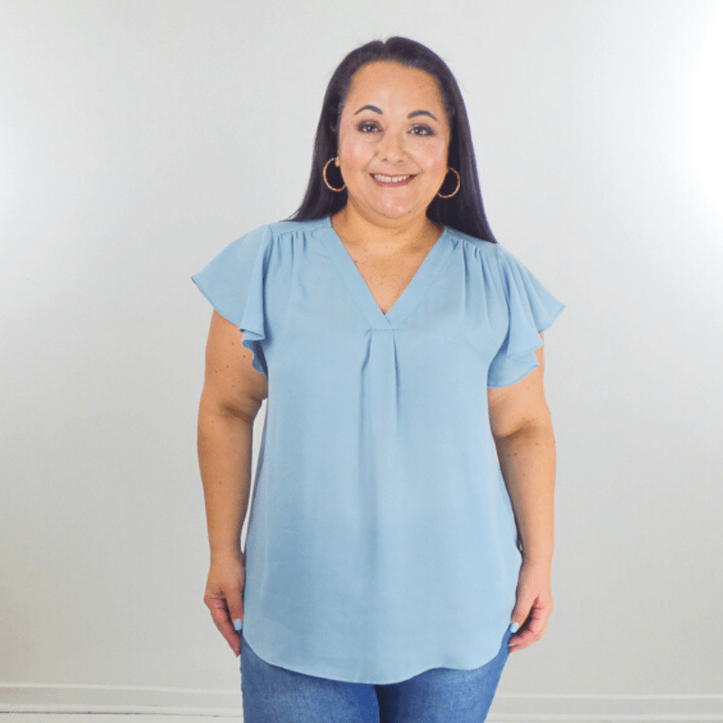 Make a statement in this Butterfly Sleeves Plus Size Top. This blouse is crafted from a soft and flowing material with chic ruffle sleeves. Wear it with your favorite pair of shorts or jeans.