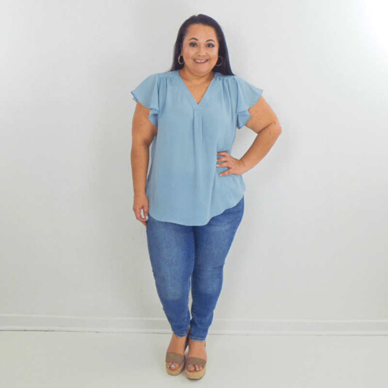 Make a statement in this Butterfly Sleeves Plus Size Top. This blouse is crafted from a soft and flowing material with chic ruffle sleeves. Wear it with your favorite pair of shorts or jeans.