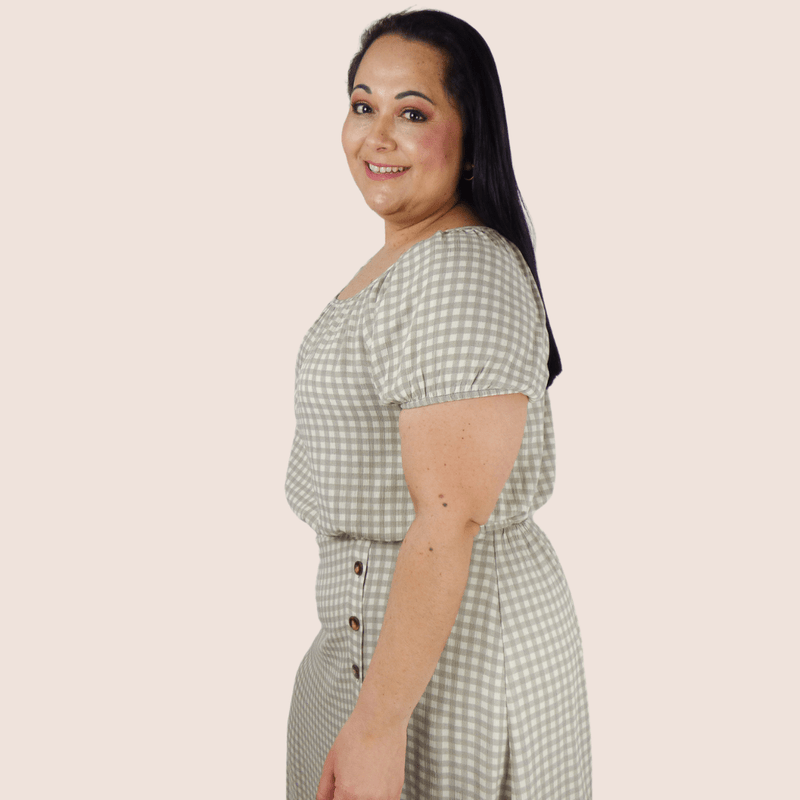 Fun and flirty, you'll flip for our Gingham Plus Size Cropped Top! This top features a cropped length, balloon sleeves and smocked elastic waist.