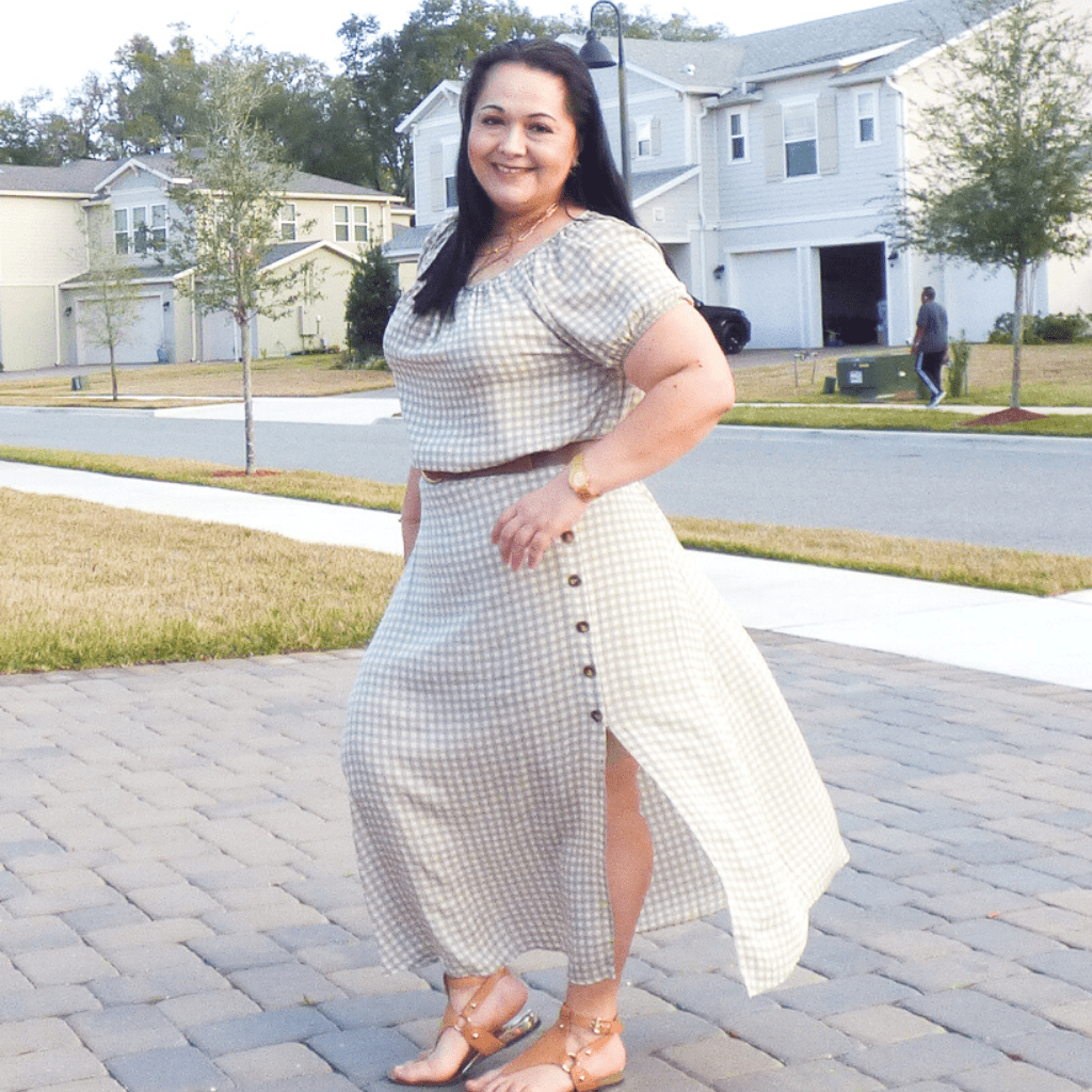 This plus-size, super cute skirt is the perfect dress up or down midi length. Featuring a gingham pattern, back elastic waist and buttons up the side slit