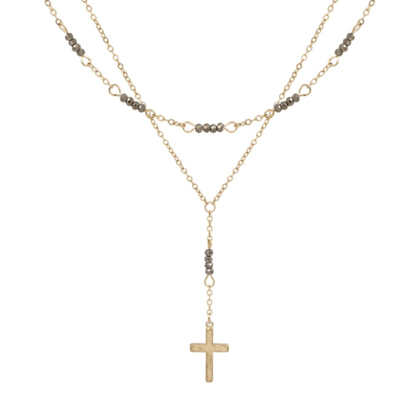 This Gold and Grey Crystal with Cross 18" Layered Necklace is a piece that you can wear every day. This necklace features two layers of gold tone metal with crystals and a cross as the centerpiece.