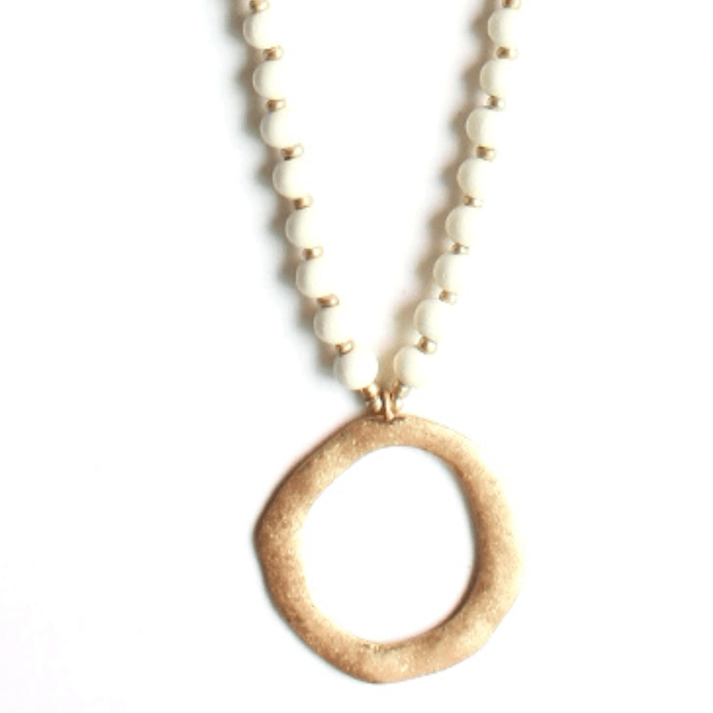 This beautiful black wood bead and gold circle necklace is a must-have for fall season. The length can be adjusted to just the right fit, making it perfect for any occasion.
