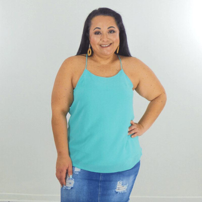This classic razorback cami tank is so chic. It features a super woven fabric with a round neck style, shell lining, & spaghetti razorback straps. The perfect layering piece