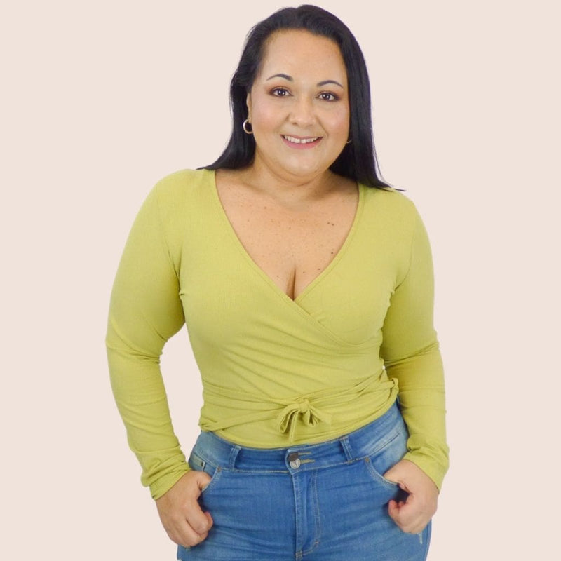 Our Plus Size Wrap Top is a simple, stylish top with self spaghetti straps that tie on the waistline. This sexy top is perfect for everyday wear.