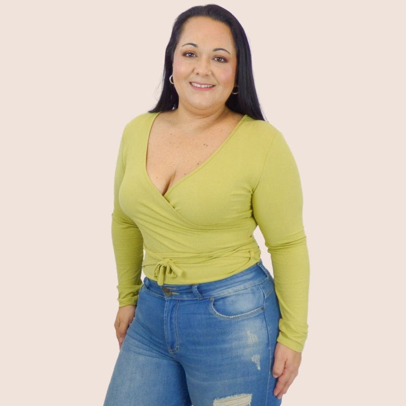 Our Plus Size Wrap Top is a simple, stylish top with self spaghetti straps that tie on the waistline. This sexy top is perfect for everyday wear.