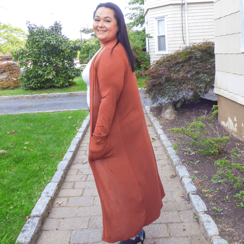 Take on any day with this Long Pocket Cardigan featuring soft lightweight material, long sleeves, front pockets, and a draped open front silhouette.
