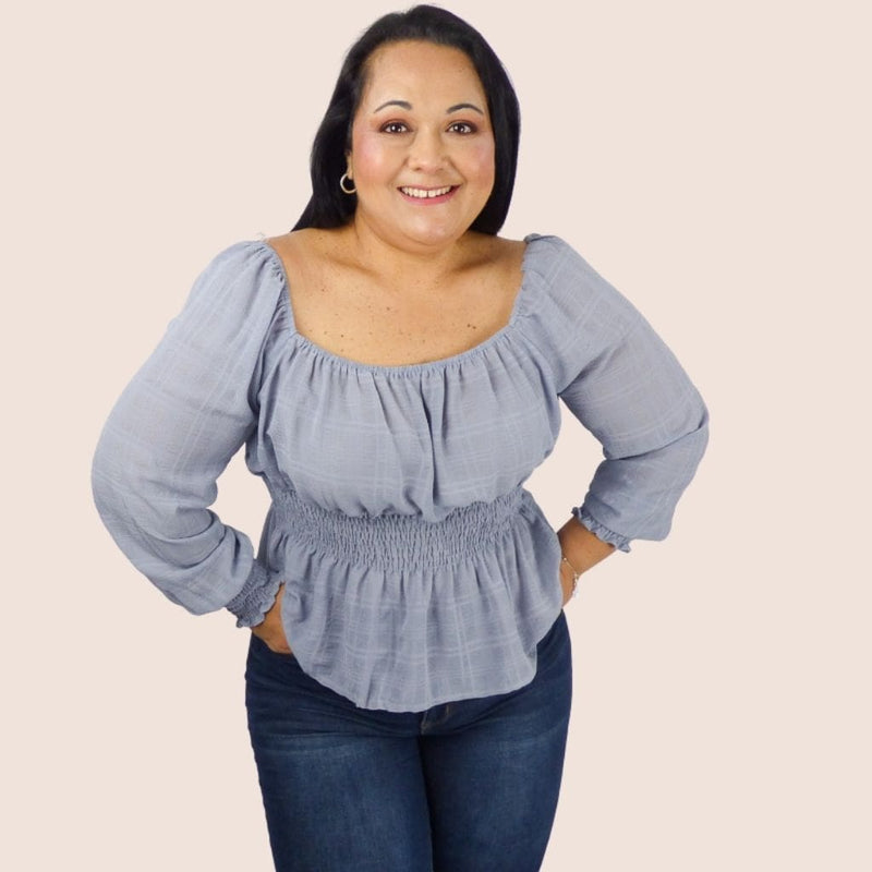 Plus Size Long Sleeve Peasant Top has an elastic neckline which gives it a touch of feminine and flirty. The rushing on the waist will help define the midsection.