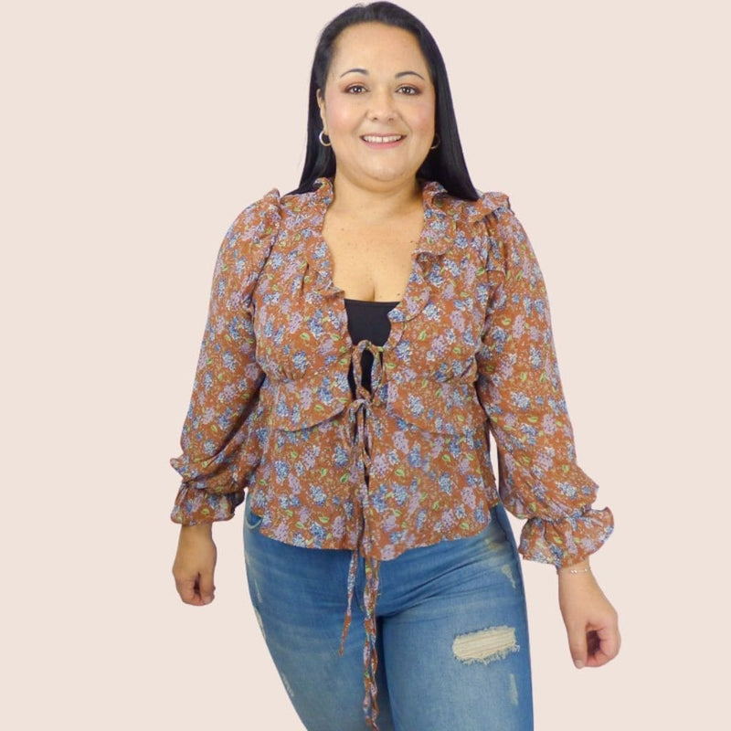 This Long Sleeve Floral Top with front tie closure is designed perfectly for the weekend. This top can easily be worn with jeans, pants or shorts.