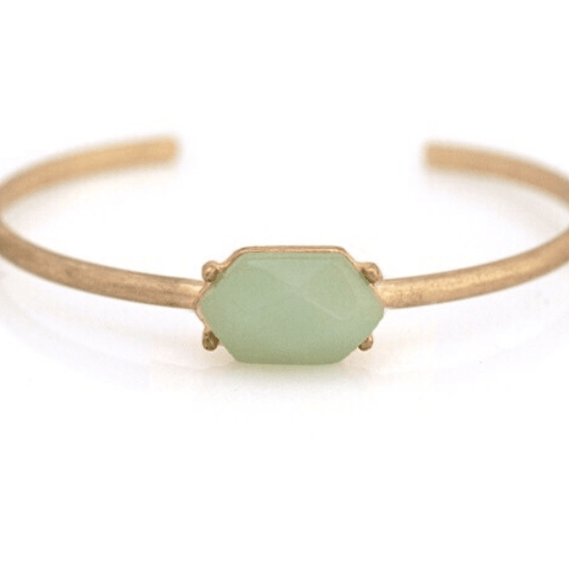 This beautiful cuff is perfect for adding some green to your outfit. Featuring a semi precious stone, it's sure to be the highlight of any ensemble!