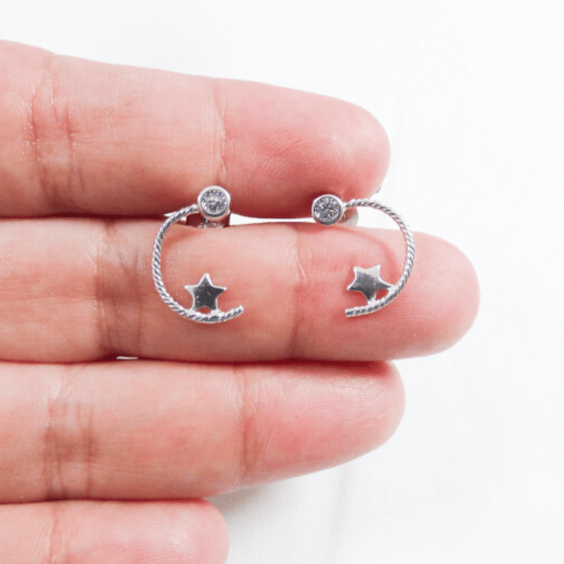 Enchanting and full of character, these earrings are crafted from 925 sterling silver. The sterling silver moon and star are set with a white cubic zirconia stone.