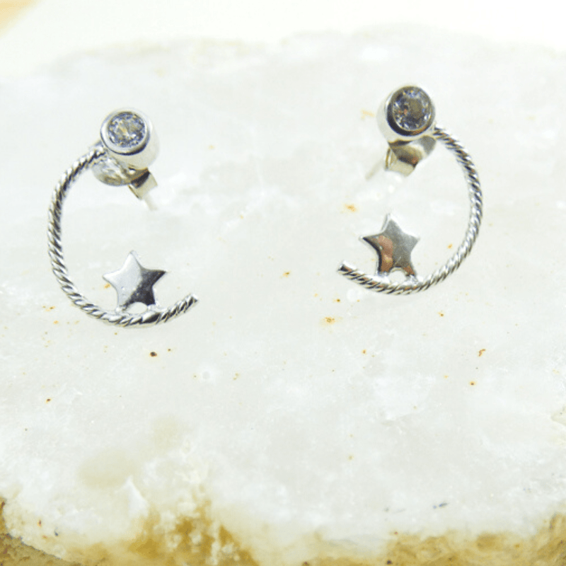 Enchanting and full of character, these earrings are crafted from 925 sterling silver. The sterling silver moon and star are set with a white cubic zirconia stone.