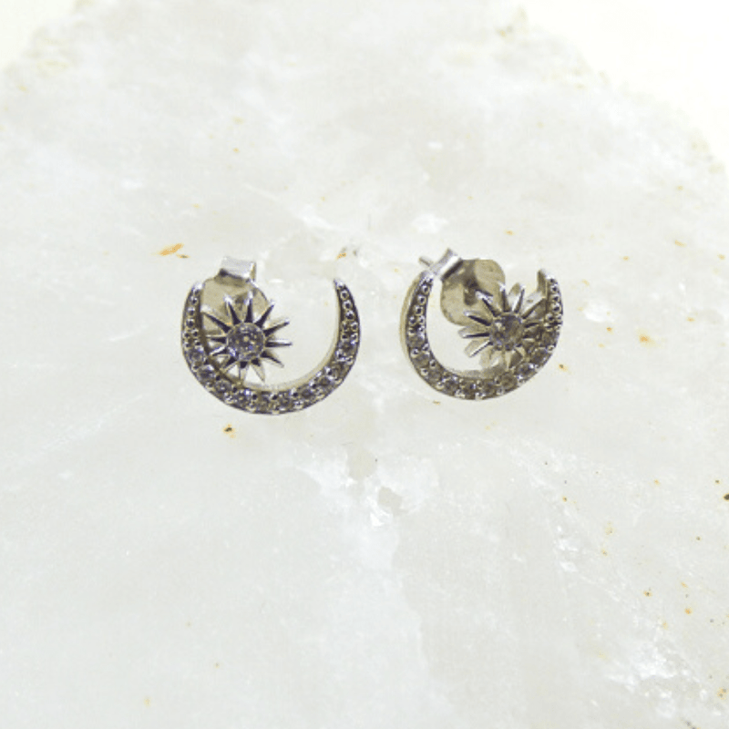The perfect pair of everyday earrings, these sterling silver sun and stars will take you from the office to a night on the town in style.