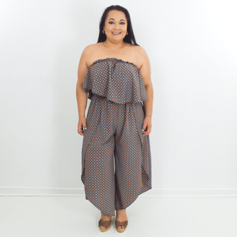 This effortless boho jumpsuit is perfect for any occasion. It's wide leg, off-shoulder cut, and relaxed fit are complemented by a bold and trendy print.