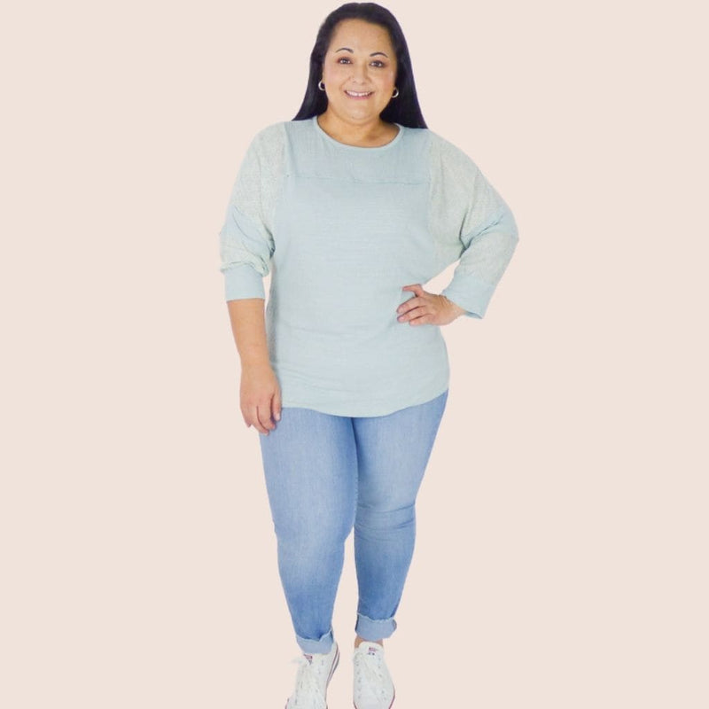 The Patchwork Sleeve Plus Size Knit Top is the perfect layer for milder temps. Its soft jersey fabric features stitch detail throughout, along with long batwing sleeves.