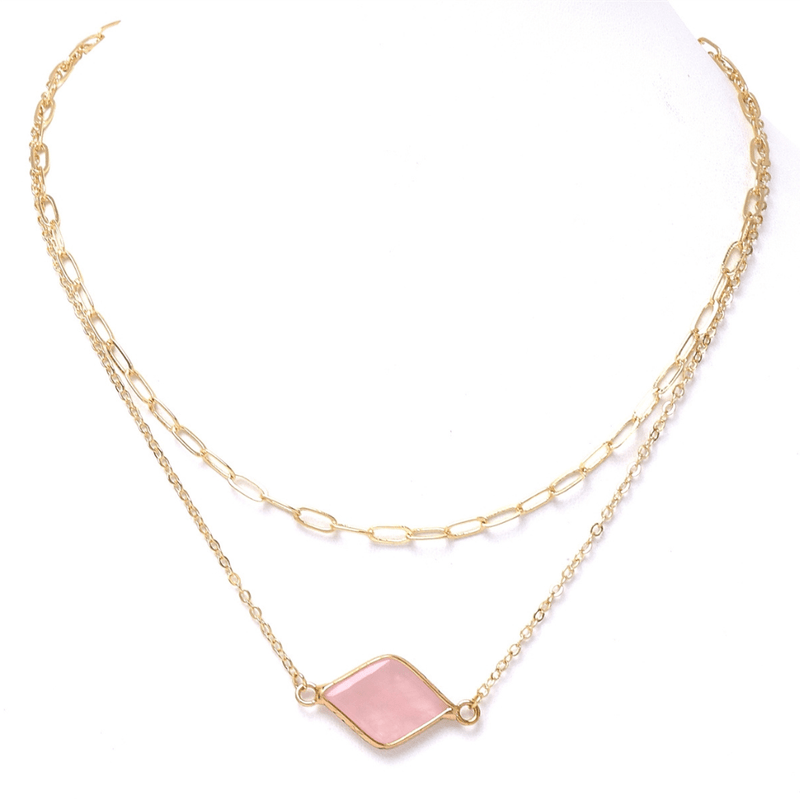 This stylish necklace is crafted with a fabulous combination of gold and pink natural stone. This layered necklace features a secure lobster claw closure and expands from 16" to 18".