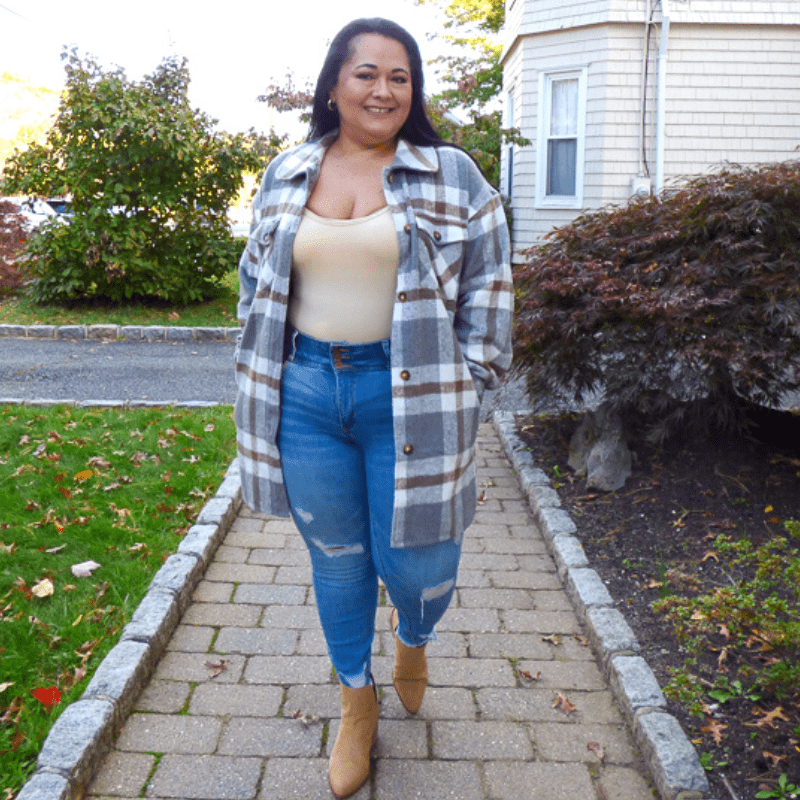 Get your hands on our new shacket! Our Tommy Plaid Tunic Shacket mixes charcoal, grey, camel, and ivory plaids. Features a collar, pockets, and front button closures.