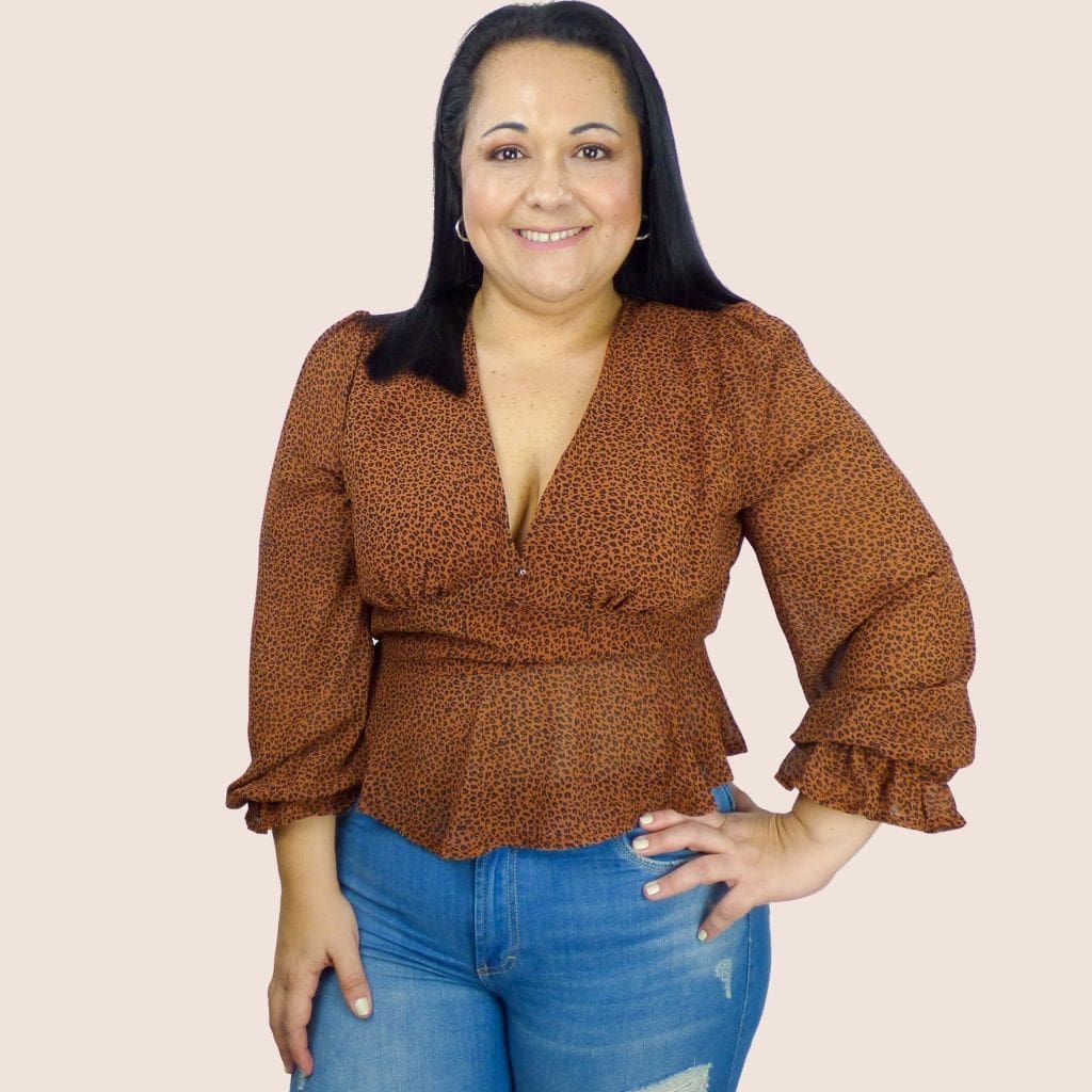 This animal print plus-size long sleeve peplum top has a stretchy waist that will provide a flattering fit for most body types. The decorative buttons adds an extra touch