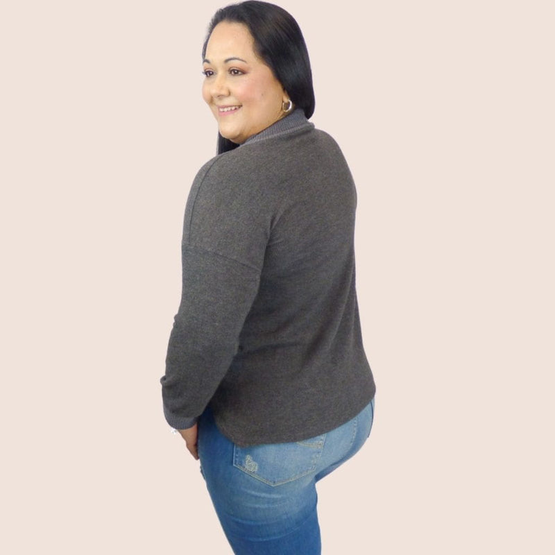 Trendy side button plus size sweater pullover top. This Top will keep you looking fashionable no matter where you go. Great with leggings, jeans or slacks.