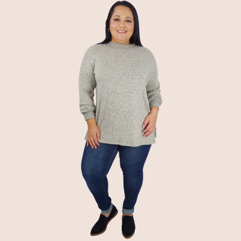Trendy side button plus size sweater pullover top. This Top will keep you looking fashionable no matter where you go. Great with leggings, jeans or slacks.