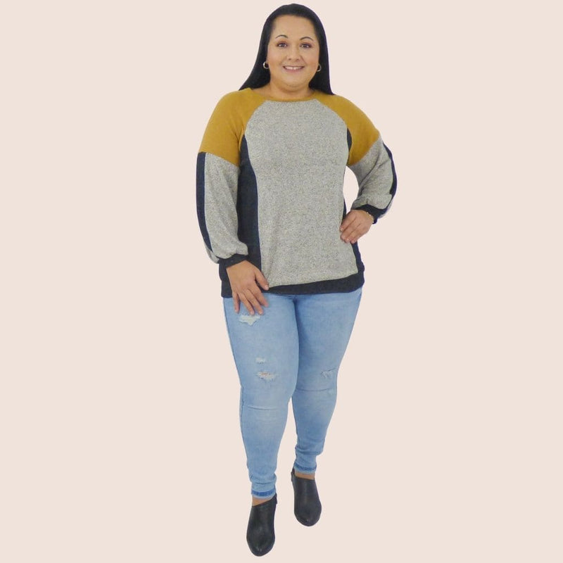 Ultra Soft Plus Size Color Block Pullover Sweater Top with a color block design and balloon sleeves will look great with leggins or a pair of jeans.