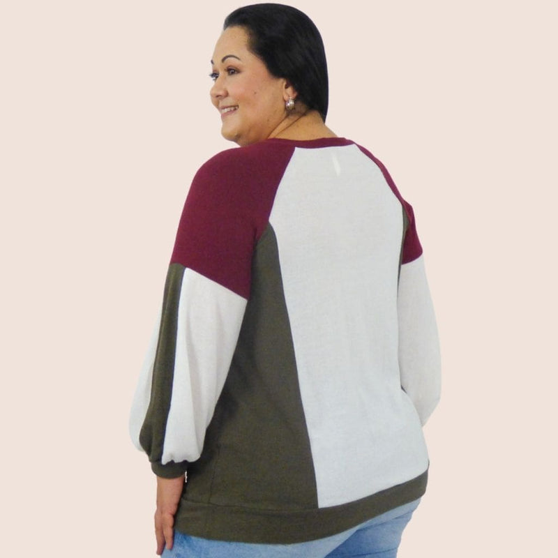 Ultra Soft Plus Size Color Block Pullover Sweater Top with a color block design and balloon sleeves will look great with leggins or a pair of jeans.