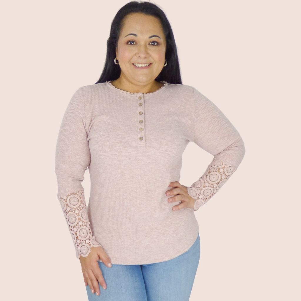 Warm and light, long sleeve plus size tee. It features crochet sleeves and button detail. This top will look great with a pair of jeans or trousers for a casual look.
