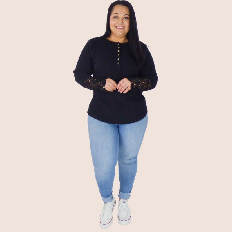 Warm and light, long sleeve plus size tee. It features crochet sleeves and button detail. This top will look great with a pair of jeans or trousers for a casual look.